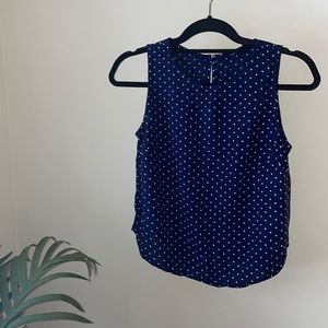 Navy blue polka dot sleeveless blouse